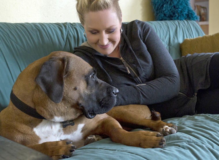 Image: Megan Watkins takes a moment to pet Florence