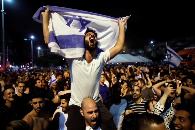 Image: People celebrate the winning of the Eurovision Song Contest 2018 by Israel's Netta Barzilai with her song "Toy" , Rabin square in Tel Aviv Israel