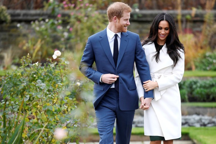 Image: Britain's Prince Harry poses with Meghan Markle in the Sunken Garden of Kensington Palace, London
