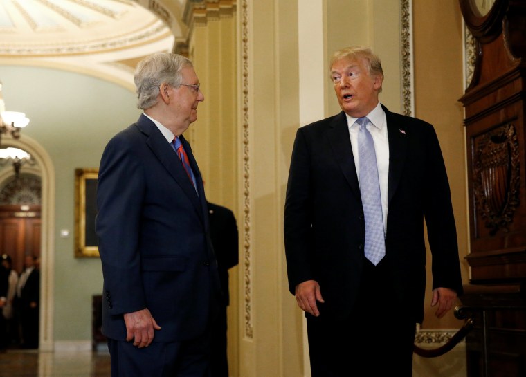 Image: President Donald Trump stops to speak with members of the media as he attends the Senate Republicans' weekly policy lunch