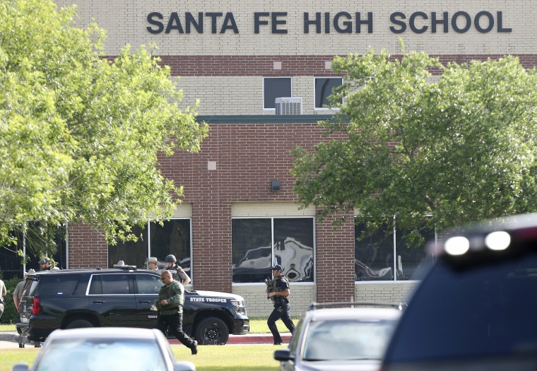 Law enforcement officers respond to Santa Fe High School after an active shooter was reported on campus.