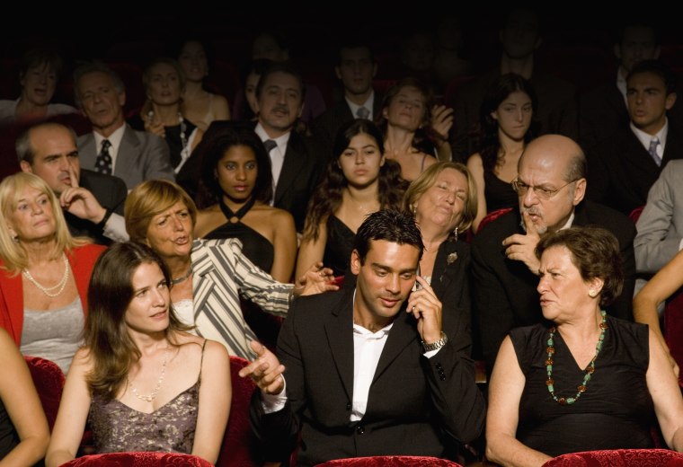 Image: Man being rude in theater