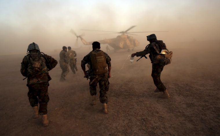 Image: Afghan army commandos train at the Shorab military camp in Helmand province