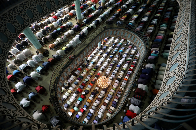Image: Muslims perform Friday prayer on the first day of Ramadan at Baitul Mukarram National Mosque in Dhaka