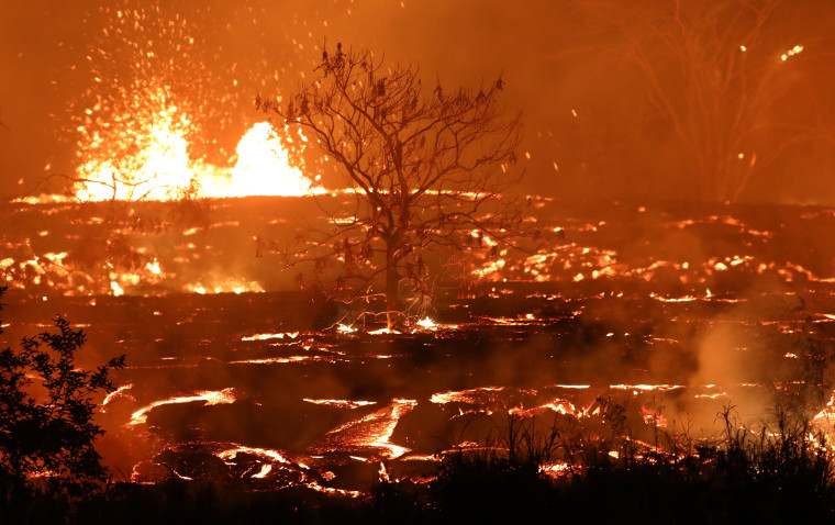 Image: Lava erupts and flows from a Kilauea volcano fissure in Kapoho