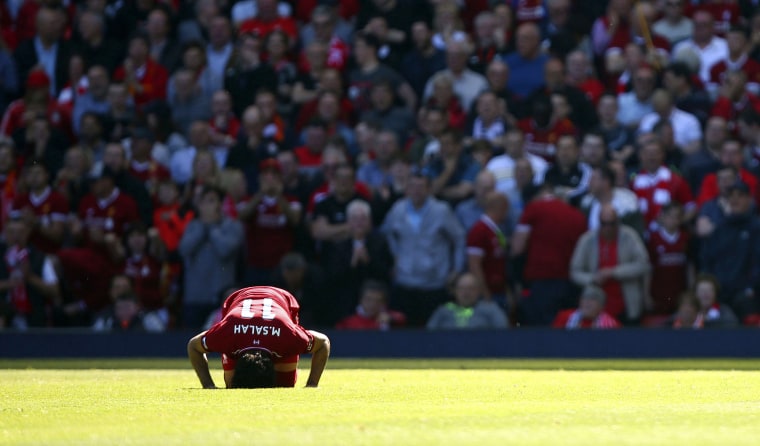 Liverpool's Mo Salah celebrates scoring against Brighton and Hove Albion on May 13.