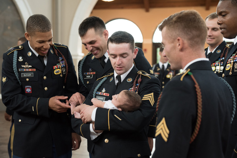 The soldiers who served alongside Chris Harris delighted in meeting his baby girl together. 