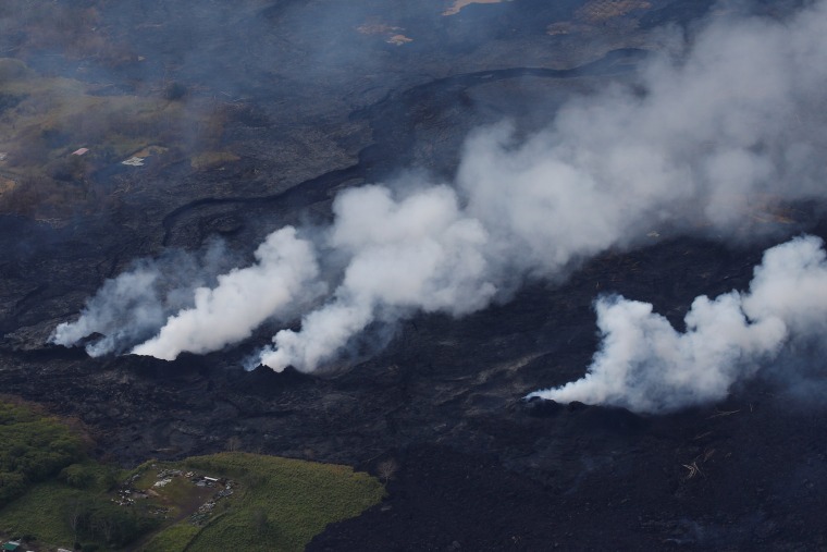 Image: Volcanic gases rise from a fissure on the lava field in the Leilani Estates near Pahoa, Hawaii