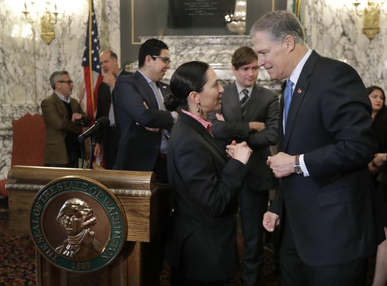 Image: Rebecca Saldana and Jay Inslee