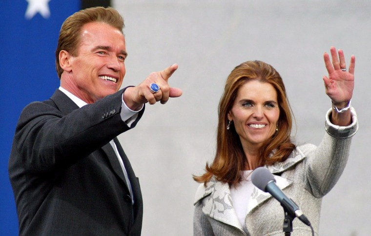 Image: Then California Governor Arnold Schwarzenegger and his wife Maria Shriver wave after the finish of his Inauguration ceremony at the Capitol in Sacramento, California, Nov. 17, 2003.