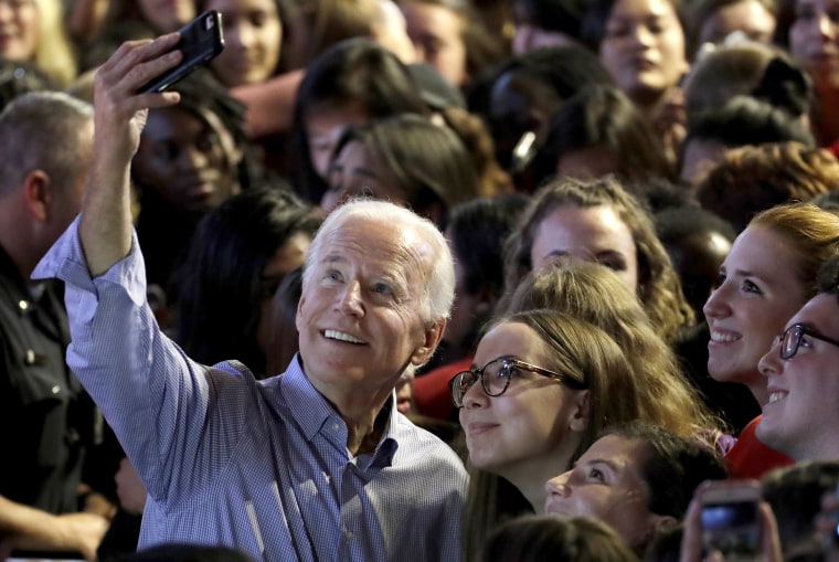 Former Vice President Joe Biden takes a selfie with students