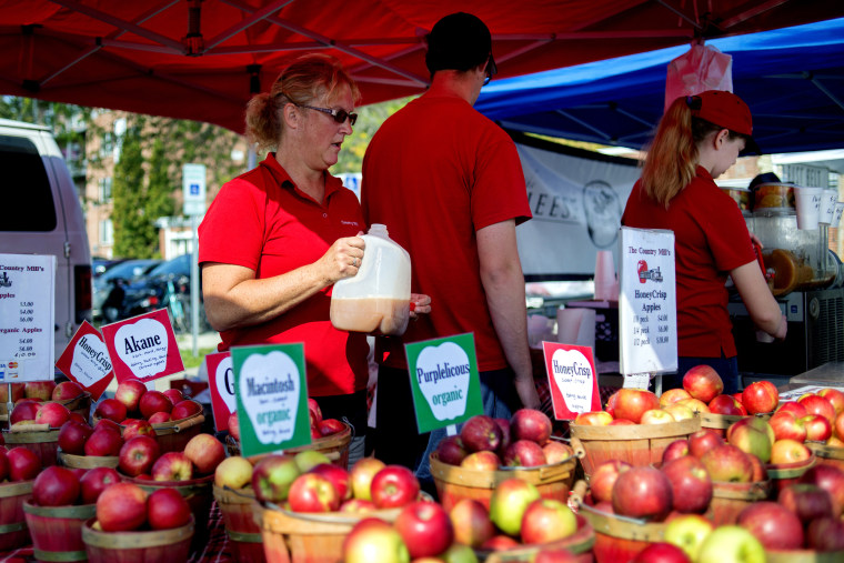 Image: Country Mill Farms employees sell products on Sept. 17, 2017, at the East Lansing Farmer's Market in East Lansing, Michigan.