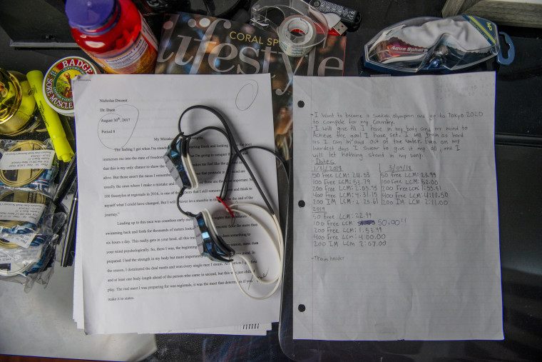 Image: Nick Dworet's swim goggle sit on top of a school paper he had written for a class