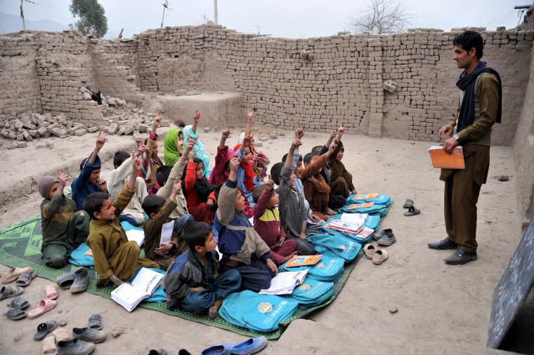 Image: Afghan school children study at an open classroom in the outskirts of Jalalabad on Jan. 30, 2013. Afghanistan has had only rare moments of peace over the past 30 years.