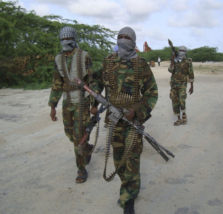 Image: Hard-line Islamist Al Shabab fighters conduct military exercise in northern Mogadishu's Suqaholaha neighborhood, Somalia