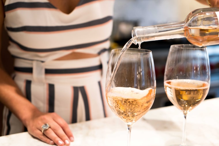 pouring a glass of rosé