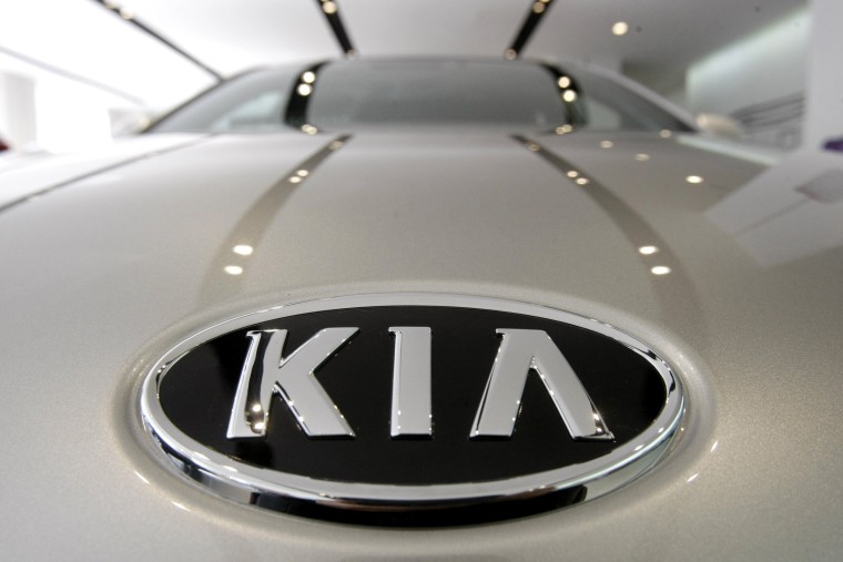 Image: KIA Motors logo on a K7 sedan at a showroom in Seoul, South Korea.