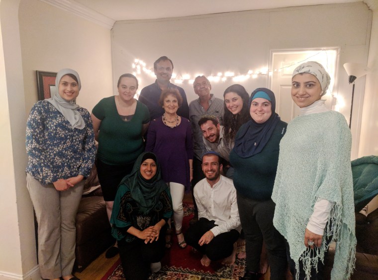 Image: Rivka Cohen,third from right, with Jewish and Muslim guests who gathered at her home for an Iftar and Sabbath meal