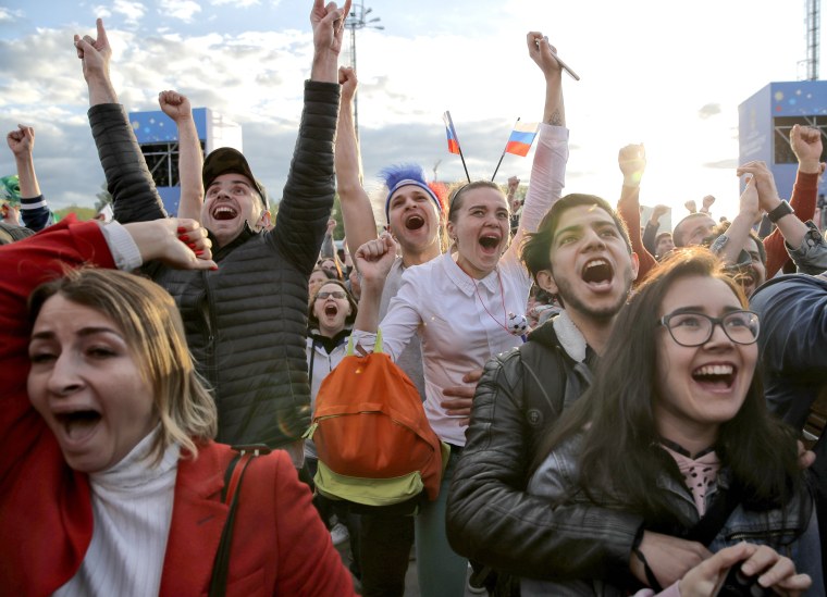 Image: Fans celebrate after Russia scored the first goal during the opening match of the World Cup