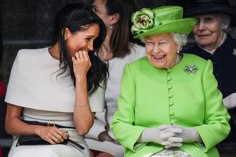 Image: Queen Elizabeth II laughs with Meghan, Duchess of Sussex, during a ceremony to open the Mersey Gateway Bridge