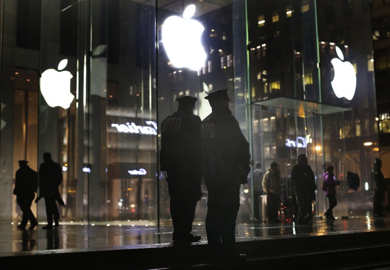 Image: Police stand outside an Apple Store in New York