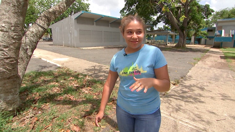 Image: Noeliz Fernandez, 12, walks around the grounds of her school, Ramon Emeterio Betances School, in Arecibo, Puerto Rico.