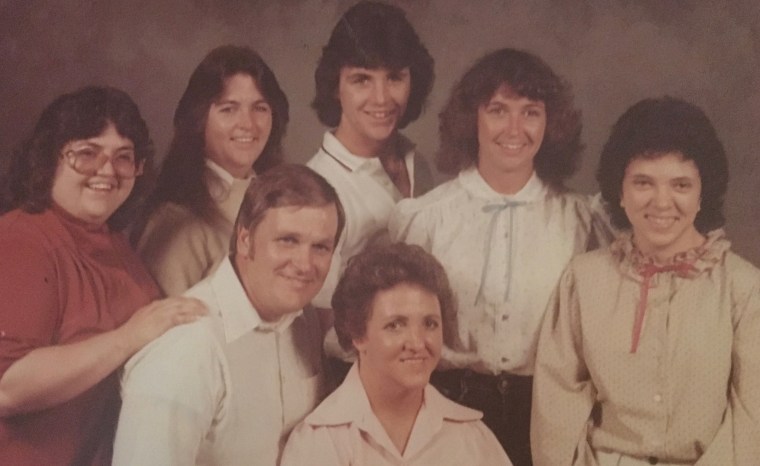 Kelly Bergh-Dove top row, second from right with her family.