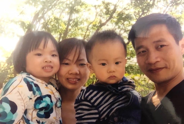 Image: Xiu Qing You, right, his wife Yu Mei Chen and two children