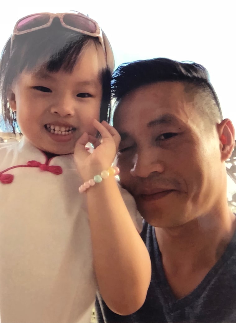 Image: Xiu Qing You with his daughter Mia