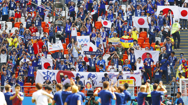 Football fans cheer for the Japanese national football team in Saransk, Russia, on June 19, 2018, ahead of their World Cup group stage match against Colombia.