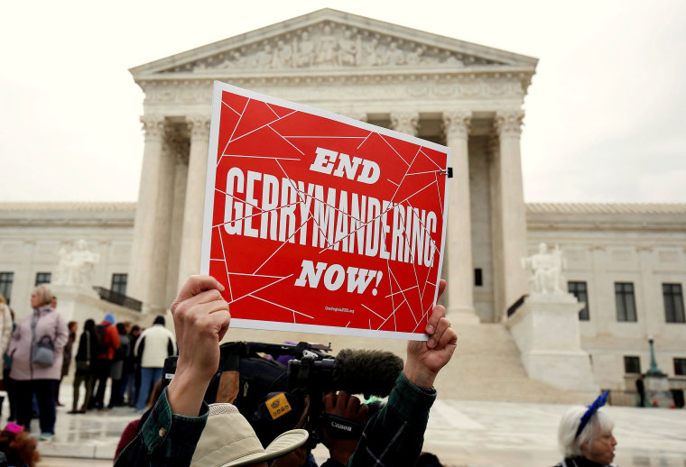 Image: Demonstrators rally in front of the Supreme court before oral arguments on Benisek v. Lamone in Washington