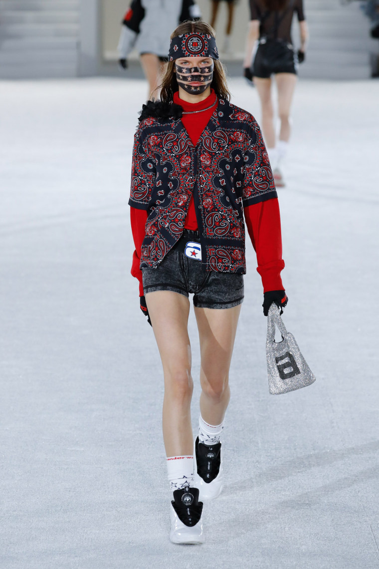 Image: A model walks the runway at the Alexander Wang Collection 1 show at Pier 17 in New York