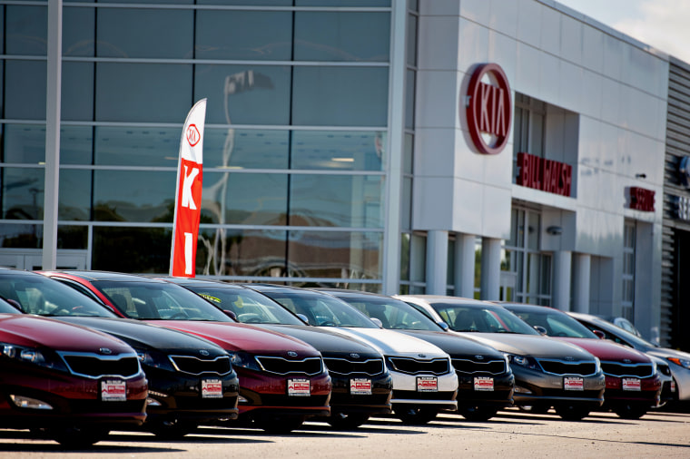 Image: Kia Motors Corp. vehicles sit outside a Kia car dealership in Ottawa