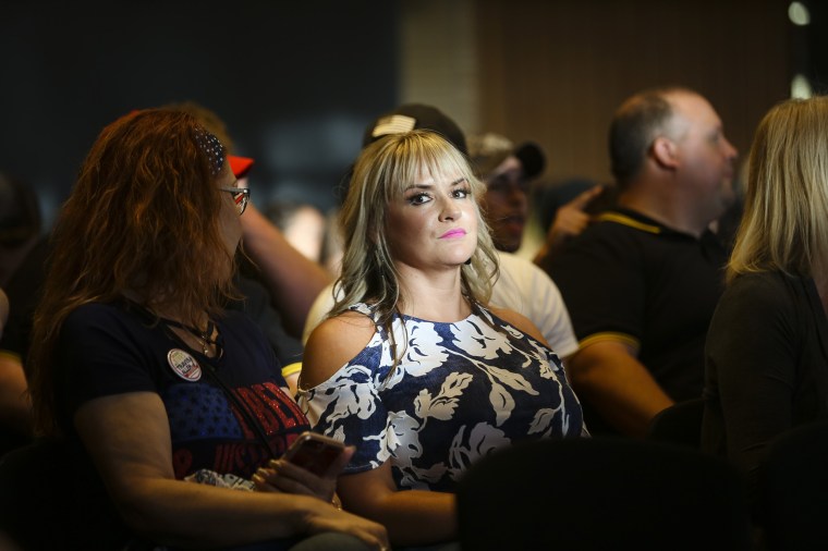 Image: A woman waits to hear Candace Owens speak