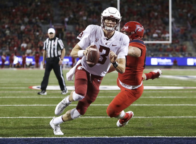 Washington State quarterback Tyler Hilinski (3) breaks the tackle of Arizona defensive lineman Luca Bruno (60) and scores a touchdown in the second half during an NCAA college football game