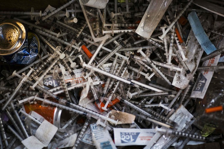 Image: Discarded needles at a heroin encampment