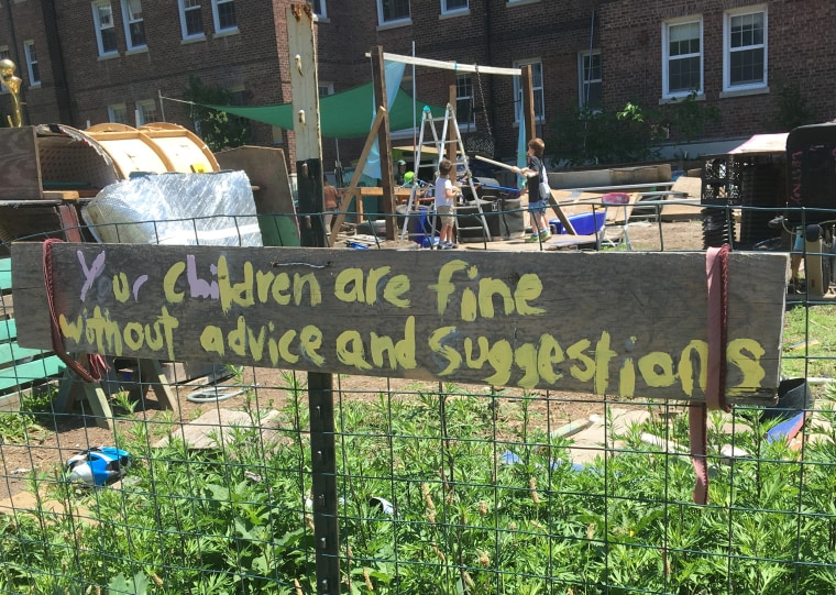 A sign at the adventure playground encourages parents not to intervene. 