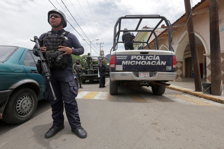 Image: Mexican police officers arrested on murder involvement suspicion