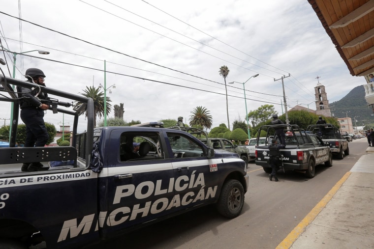 Image: Mexican police officers arrested on murder involvement suspicion