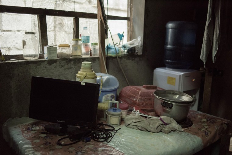 Image: A computer monitor confiscated by the authorities sits on a table during a raid