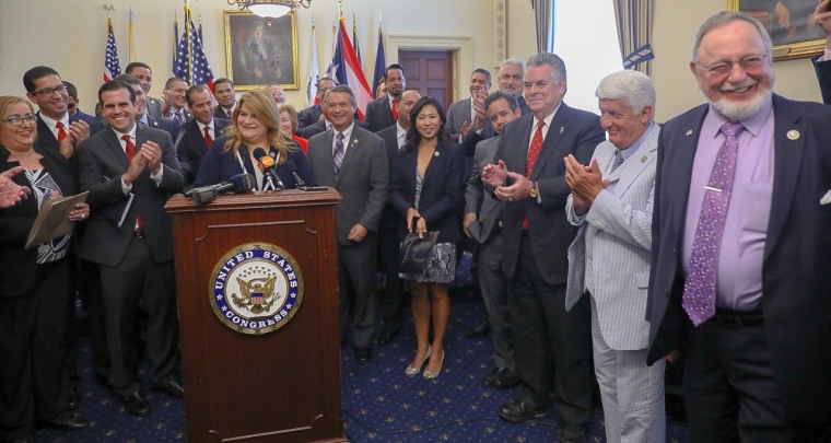 Rep. Jenniffer Gonzalez is surrounded by lawmakers while introducing a new bipartisan bill to officially pave the way to incorporate Puerto Rico as a state.