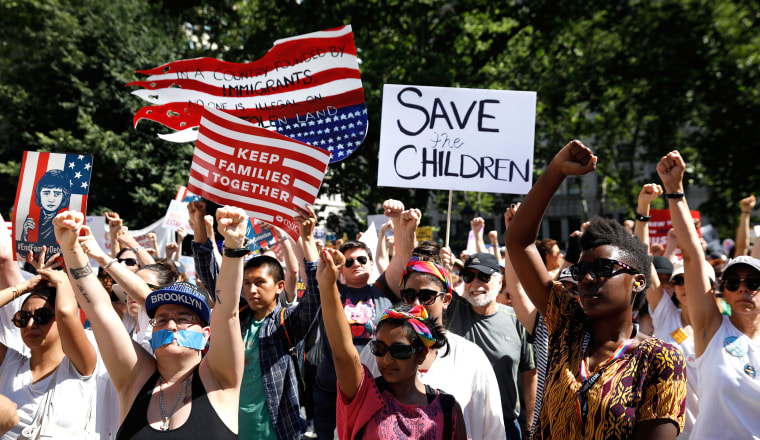 Image: Demonstrators participate in \"Keep Families Together\" march to protest Trump administration's immigration policy in Manhattan New York
