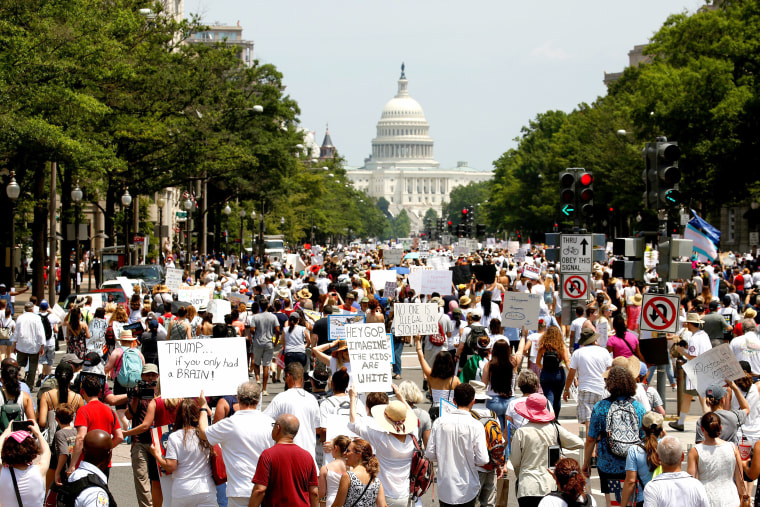 Image: Immigration activists march to protest the Trump Administration's immigration policy in Washington