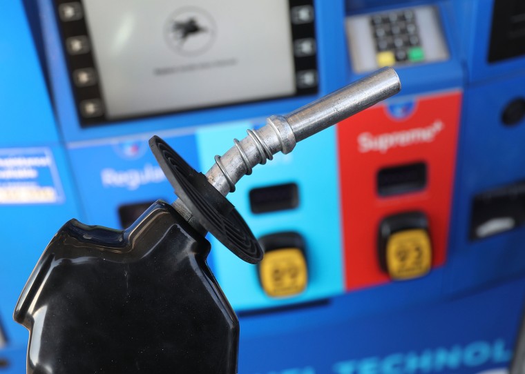 Image:  A gas pump nozzle is seen at a gas station