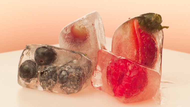 Berries frozen in ice cubes