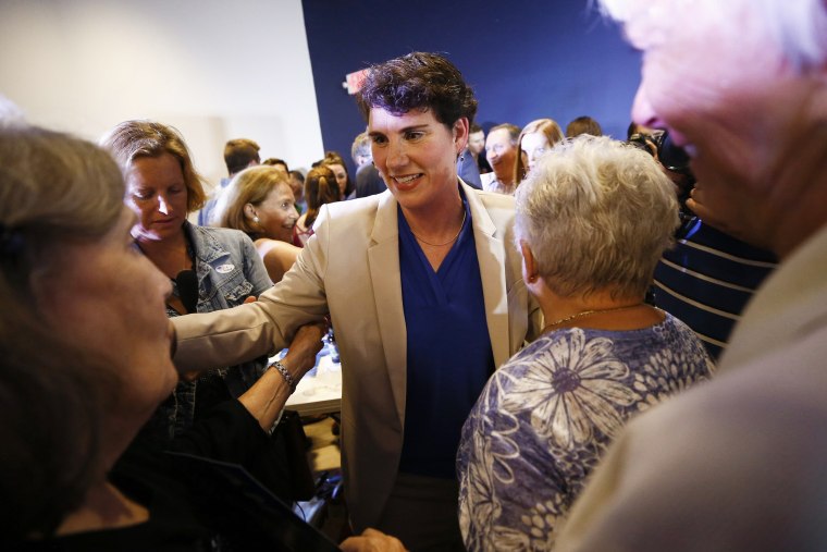 Amy McGrath greets supporters following her victory over Jim Gray