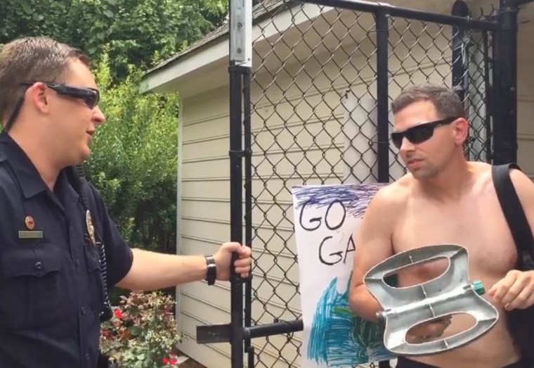 Adam Bloom talks to police at a pool in Winston-Salem, North Carolina.