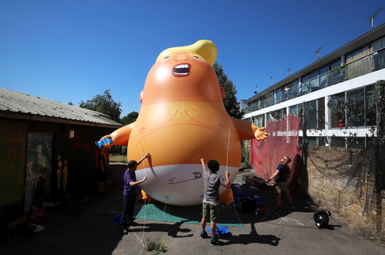 Image: People inflate a helium-filled Donald Trump blimp 