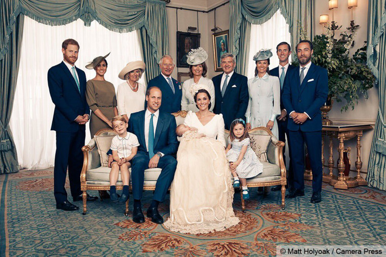 Sitting together (left to right) are Prince George, the Duke of Cambridge, baby Prince Louis, the Duchess of Cambridge and Princess Charlotte. Standing (left to right): The Duke of Sussex, the Duchess of Sussex, the Duchess of Cornwall, the Prince of Wales, Mrs. Carole Middleton, Mr. Michael Middleton, Mrs. Pippa Matthews, Mr. James Matthews and Mr. James Middleton.