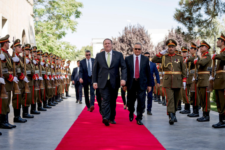 Image: U.S. Secretary of State Mike Pompeo is greeted by Chief of Staff Abdul Salam Rahimi, as he arrives at Gul Khanna in the Presidential Palace in Kabul
